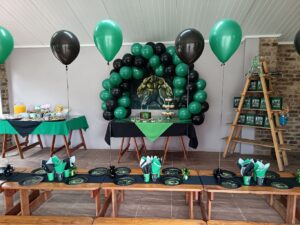 Hulk Themed Setup Black and Green Helium Balloons and Half-moon table arch with Hulk Backdrop